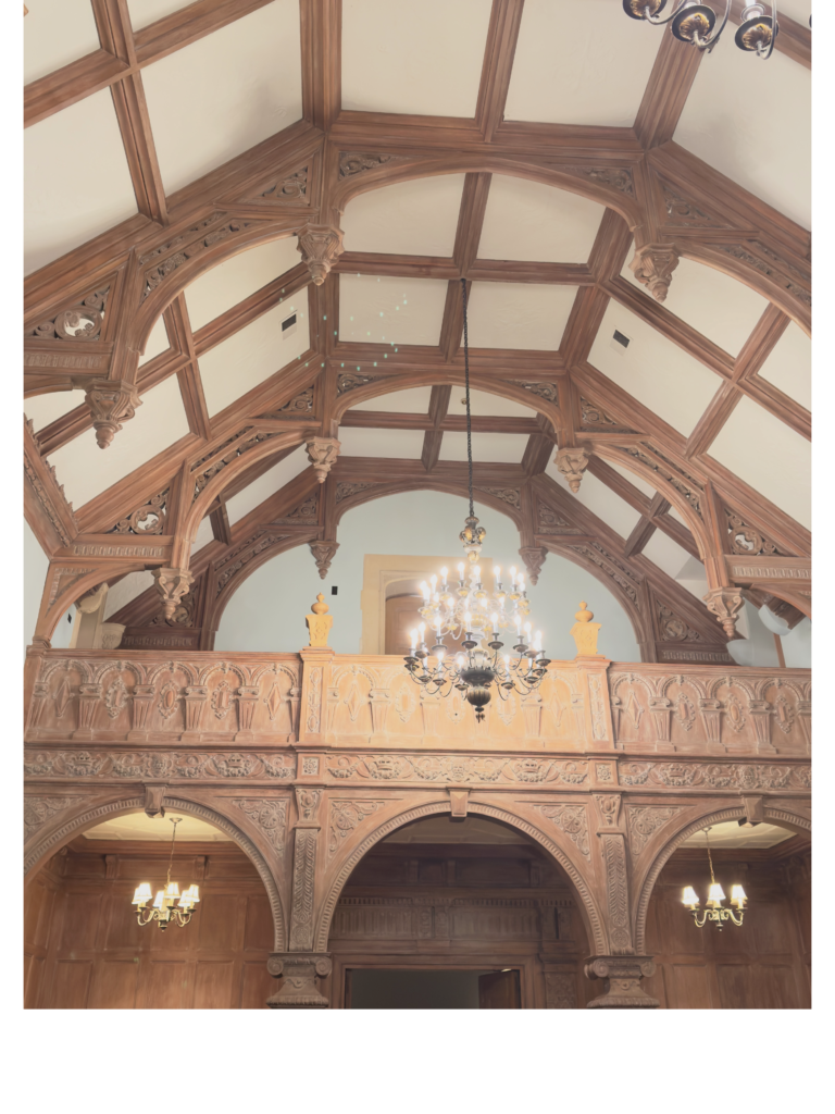 Tudor living room with gallery and chandelier 